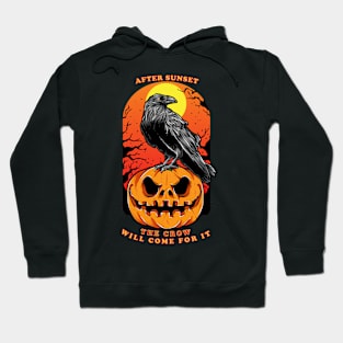 A crow deals with a pumpkin Hoodie